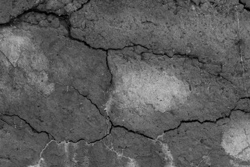 Cracked concrete texture closeup. Abstract cement background.