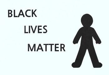 Black Lives Matter flat lay with black paper silhouette on a white background. Stop police brutality, racism and discrimination concepts.