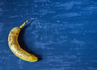 overripe banana on wooden background