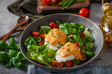Organic egg benedict with salad