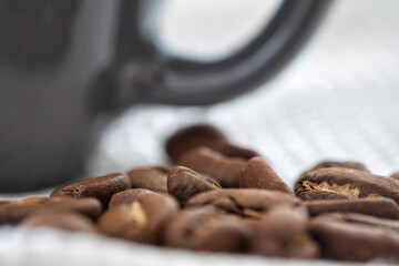 Roasted coffee beans. Brown coffee beans, of coffee beans for background and texture. Beans of roasted black coffee. Background.