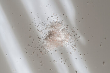 pinch of coarse sea salt isolated on the colorful surface, healthy diet