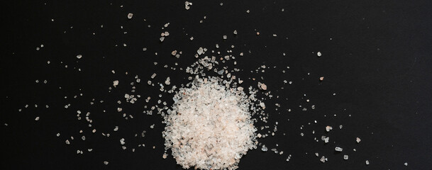 pinch of coarse sea salt isolated on the colorful surface, healthy diet