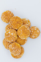 Sweet little bread with sugar on white background