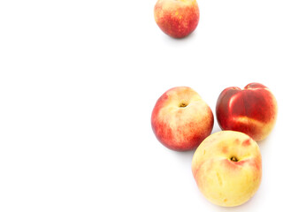 Heap of ripe juicy yellow and red nectarines isolated with shadow on white background. Summer fruits vitamins harvest healthy lifestyle concept
