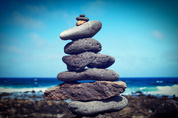 tower of stones on the beach