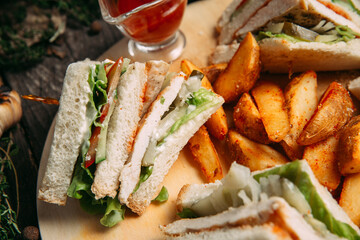 Sandwiches set with red sauce rustic potato wedges