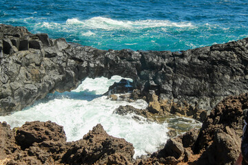 waves hitting the rock
