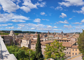 Fototapeta na wymiar Rome, Italy, areal view to the side of Capitol Hill with rouins of the Roman Forum on the bright day