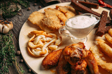 Closeup on beer snacks set on the board
