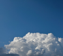 clouds swirl in the blue sky