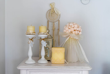 Trendy white home deccoration - 
candles, flowers 