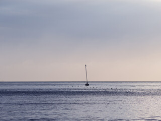 Seascape with bounding buoy on the background.