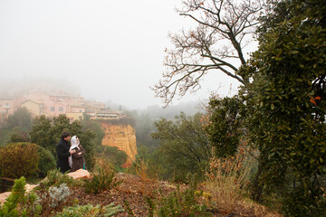 man and a woman. fog and rain, scenic small village in hills of Provence, 