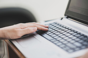 Close up hand typing on computer key board