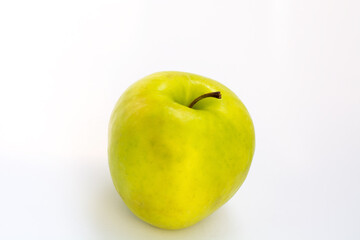 yellow-green Apple on a white background