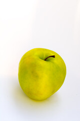 yellow-green Apple on a white background