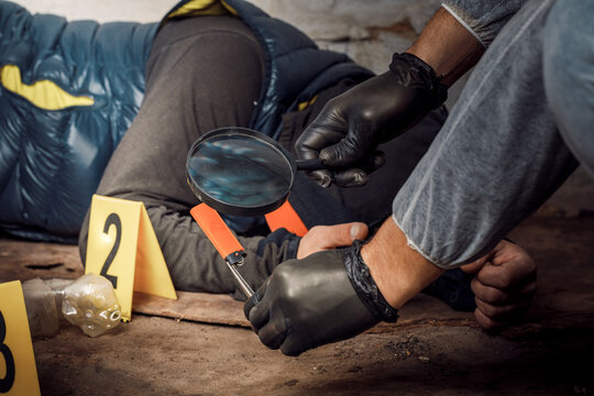 An expert is gathering evidence at a crime scene. The law and the concept of police forensics.