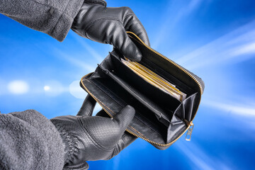thief has stolen a wallet and is searching it