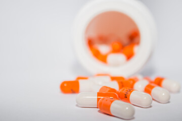 pills on a white. Tablets. Orange capsules.