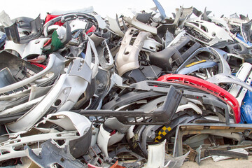 Scrapyard heap of plastic fenders from cars and motorcycles