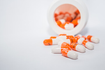 Tablets. Orange capsules.
