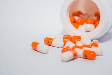 pills and tablets. Tablets. Orange capsules.