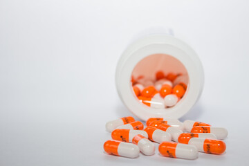pills and capsules. Tablets. Orange capsules.