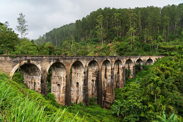 Sri Lanka Nine Arch bridge in Ella, tourist landmark. Green forest landscape view.