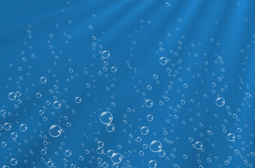 Underwater background with sunbeams and air bubbles.  Texture of water surface.