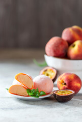 Japanese ice cream Mochi with peach, in rice dough. Traditional Japanese dessert on white background.