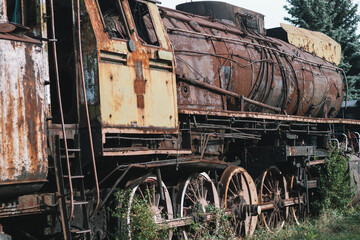 Old ruined train wagon at an abandoned train station.