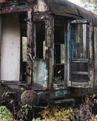 Old ruined train wagon at an abandoned train station.