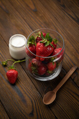 ripe farm strawberries on a wooden background

