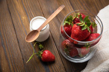 ripe farm strawberries on a wooden background

