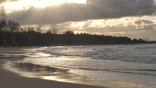 Peaceful Landscape of Stormy Sea Waves on Sandy Beach at Sunset Slow Motion
