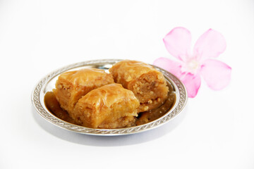 Eastern traditional sweet baklava in a decorative plate