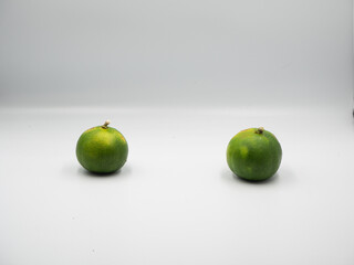 Two limes placed in the isolated white background