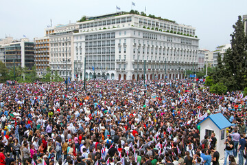 Croud of people demonstrate against government austerity measures, outside the Greek Parliament in...