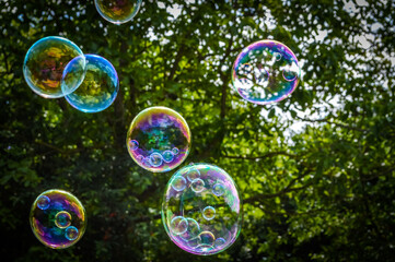 Soap bubble with smaller bubbles inside close up