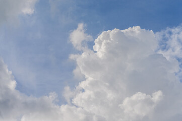 Naklejka na ściany i meble Big clouds in blue sky background
