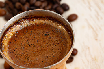 Turkish coffee with foam in copper turk