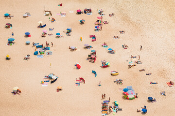 Ocean long beach with umbrellas drone view. Beautiful long ocean beach. 