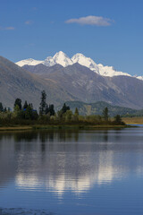The mount "Belukha"  is reflected in the waters of the lake Yazevoe. (Altay, Kazakhstan)