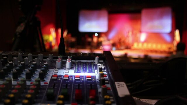 Audio mixer or mixing desk console at a live event or concert stage. Stock Video Clip Footage