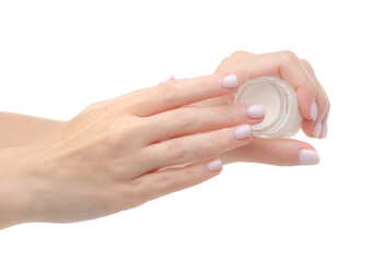 Cosmetic glass jar with coconut oil in hand on white background isolation
