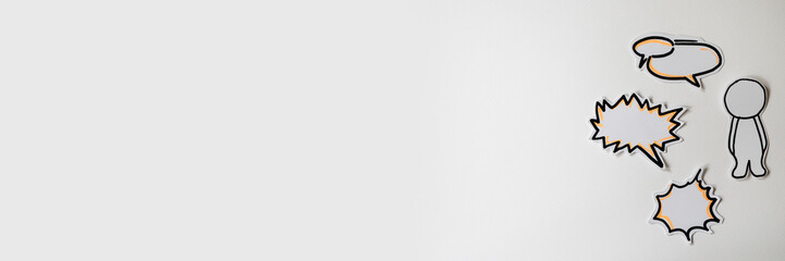 Paper figures with speech bubbles on the white