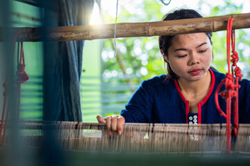 Cotton weaving from northeast Thailand. Thai indigo dye Cotton weaving in the traditional way,...