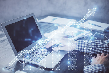 Double exposure of forex chart with man working on computer on background. Concept of market analysis.