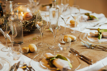 Beautiful table set for some festive event, party or wedding reception. Flowers decoration in the restaurant.